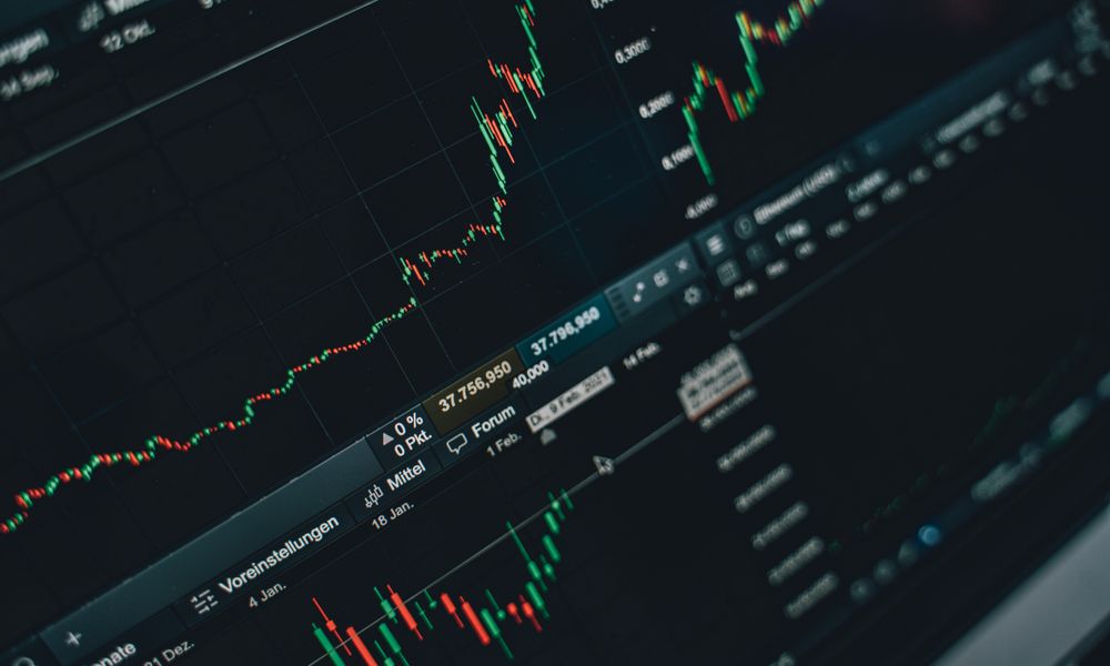 Close-up of stock market trading screen displaying financial growth and charts.