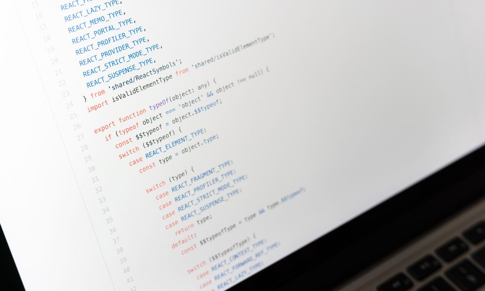 Close-up of JavaScript code on a laptop screen, showcasing programming in progress.