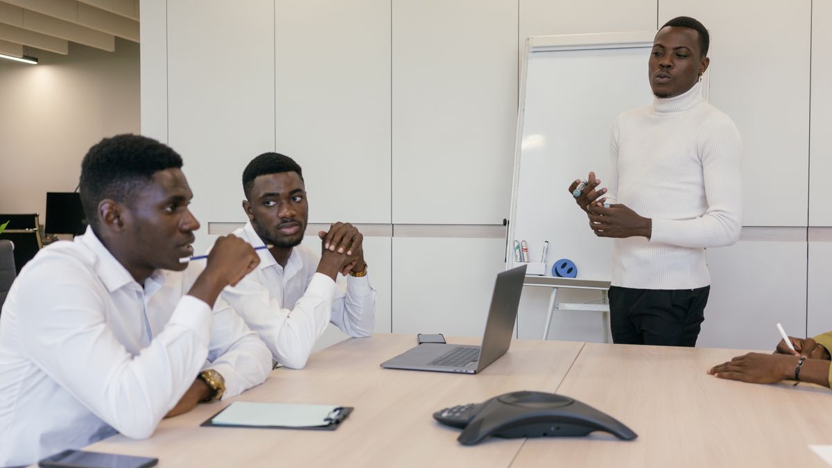 Professional team engaged in brainstorming session in modern office.