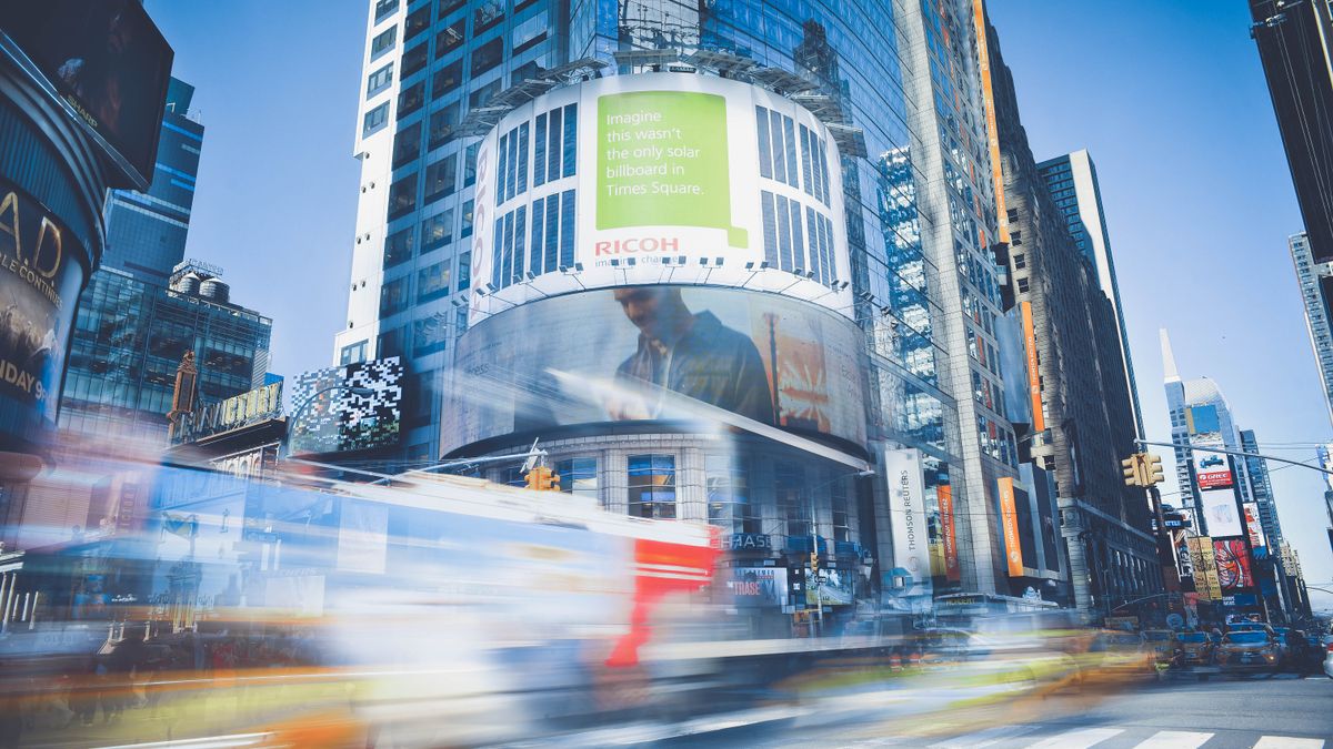Dynamic capture of Times Square showcasing bustling city life and traffic in New York City.